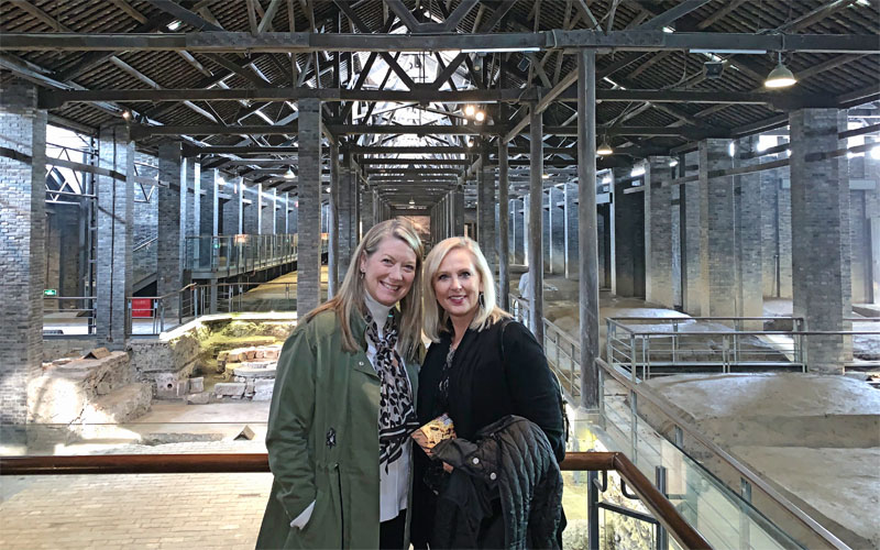 Julie and Kristen visiting a traditional Chinese liquor brewing museum sponsored by a local liquor brand.